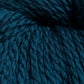 A close-up image of thick, dark teal Cascade Eco and Cascade Eco Plus Wool Yarn from Cascade Yarns showcases its soft and textured strands wound together. The fibers appear plush and densely packed, highlighting the yarn's fluffy and cozy nature.