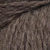 Close-up image of the textured Cascade Eco and Cascade Eco Plus Wool Yarn, showing individual fibers and strands intertwined. The Peruvian Highland wool from Cascade Yarns appears soft and thick, making it suitable for knitting or crocheting warm garments.